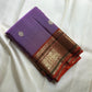 Soft lavender-purple Kanchipuram silk body scattered with understated traditional classic-gold zari buttas.