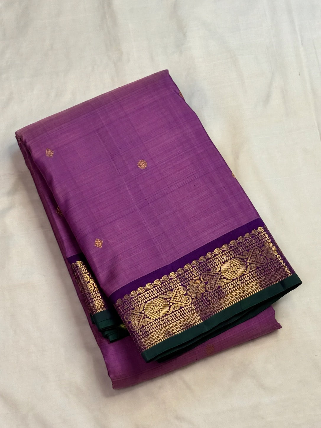 Close-up of zari butta motifs on lavender Kanchipuram pure silk saree