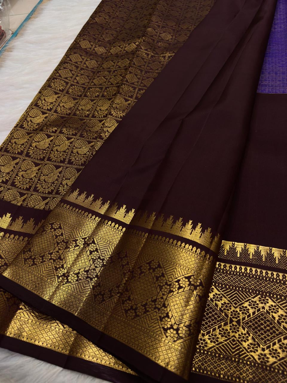 Close view of antique-gold zari butta on Kathiripoo Purple Kanjivaram silk.