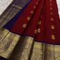 Open maroon silk body with measured spacing between ceremonial elephant zari buttas