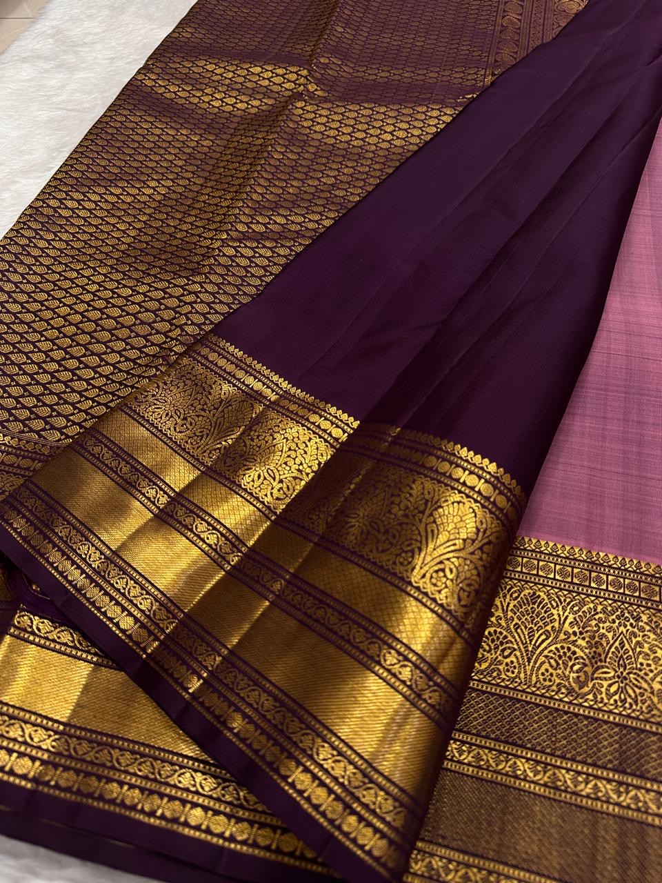 Kathiripoo purple border with classic-gold zari ornamental bands.