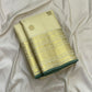 Ivory-and-gold seer pallu of a handwoven Kanjipuram silk saree with floral zari fields and ornamental bands