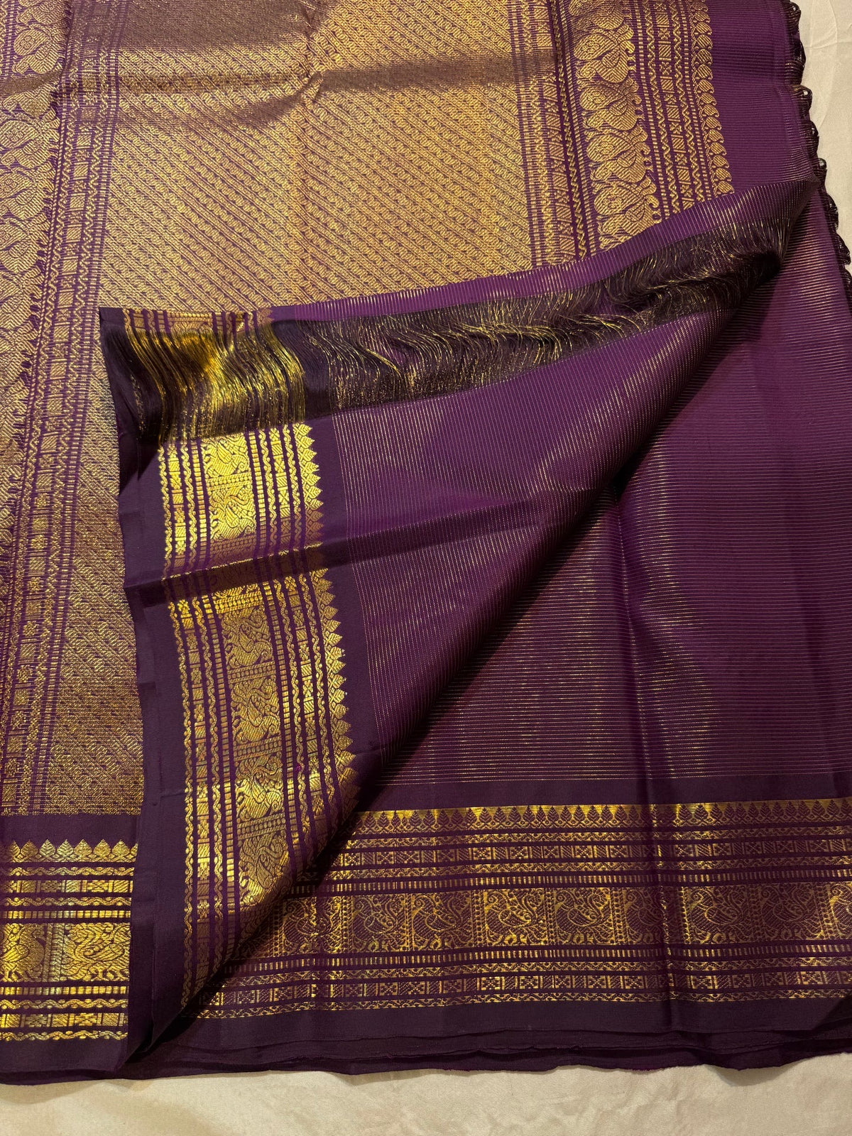 Kathiripoo purple Kanjeevaram silk saree with gold zari buttas, pallu view
