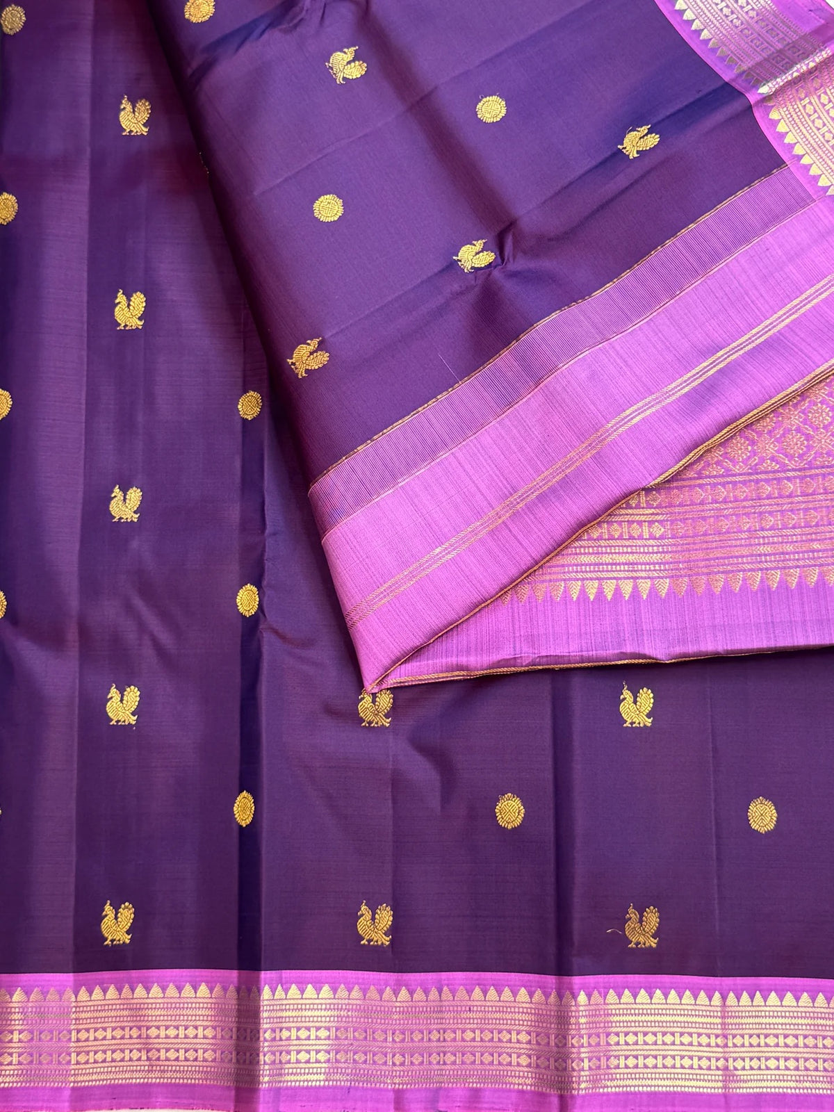 Pure silk Kanchipuram saree in Kathiripoo Purple with Oodha Pink, traditional handwoven border and zari detail