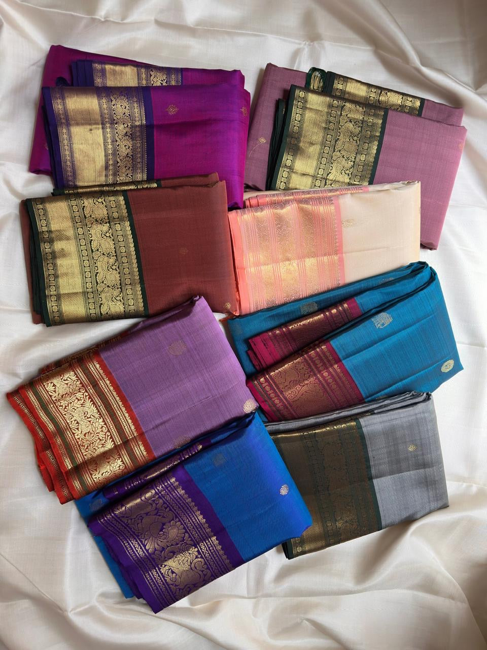 Lavender Kathiripoo Kanchipuram body framed by a warm ceremonial rust-red to Arakku-toned border.