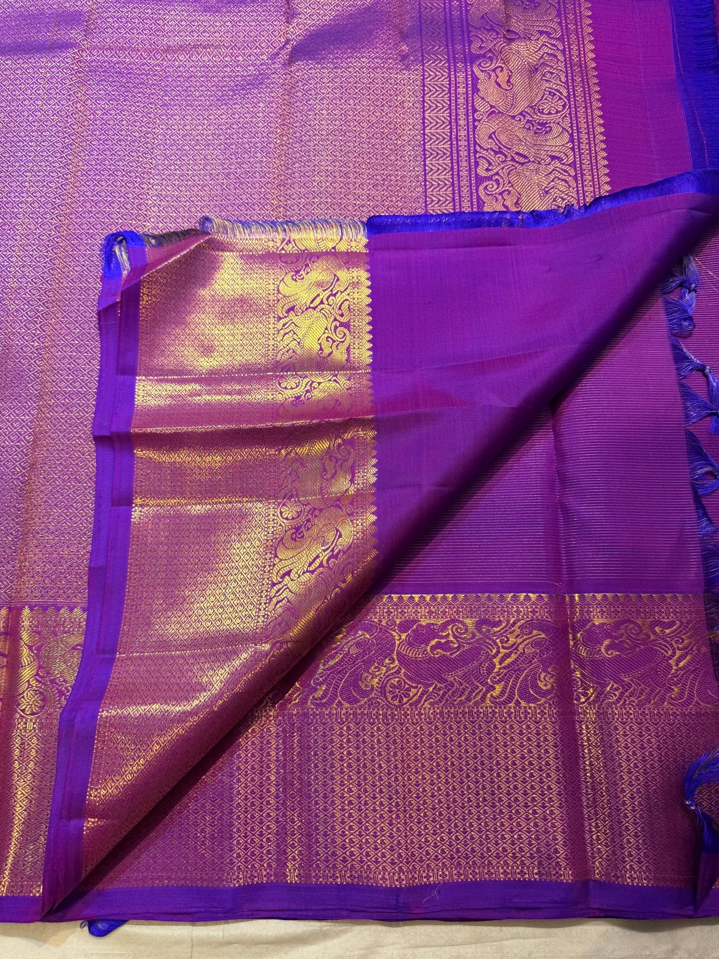 Kathiripoo Purple pure silk saree with directional Vairaoosi zari shimmer and gold bird motifs.