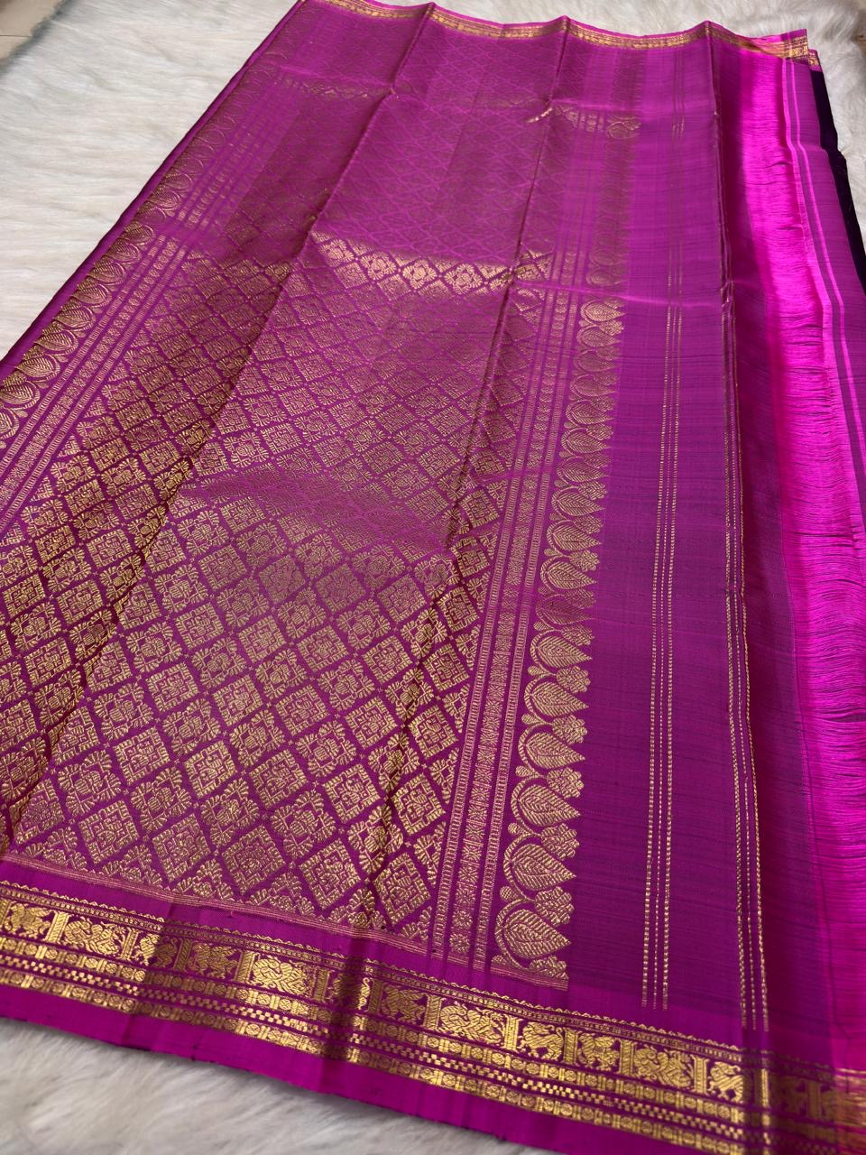 Kathiripoo violet silk body showing individually spaced small classic-gold zari buttas.