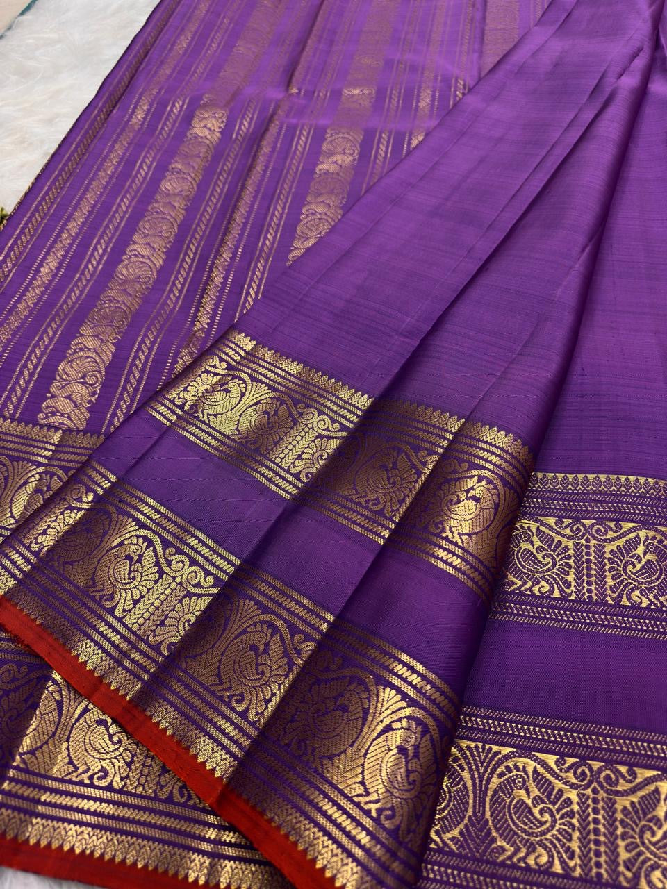 Kathiripoo Violet Handwoven Pure Silk Kanchipuram Saree with Rettapet Mayil Zari Border and Orange-Red Selvedge