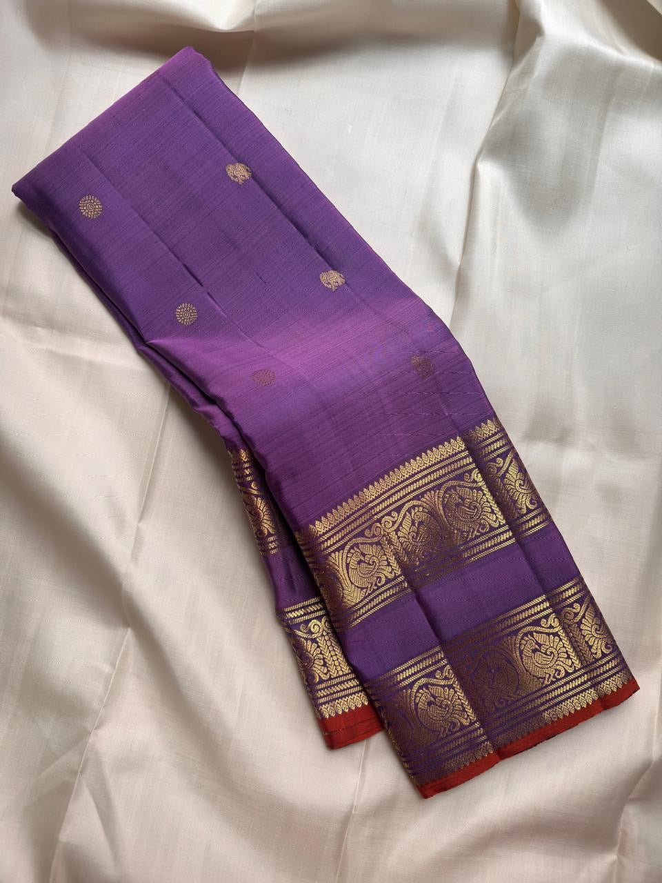 Kathiripoo Violet Handwoven Pure Silk Kanchipuram Saree with Rettapet Mayil Zari Border and Orange-Red Selvedge