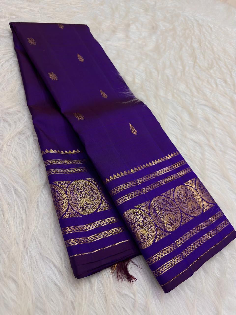 Radiant Neelam Blue pure silk Kanchipuram Varisaipet saree, layered traditional border rows.