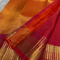 Dense Kanchipuram silk body woven with a fine all-over gold diamond grid