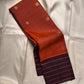 Dark kaapi brown border with broad airy gold-toned checked zari lines