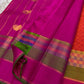 Orange Kanchipuram silk saree showing paimadi kattam checks with Vadamalli-pink and olive-green border.