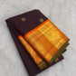 Detail of Kesari orange Kanchipuram border with layered gold zari and traditional peacock ornament.