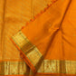 Kesari Orange Handwoven Pure Silk Kanjipuram Butta Saree with Green-Edged Gold Zari Border
