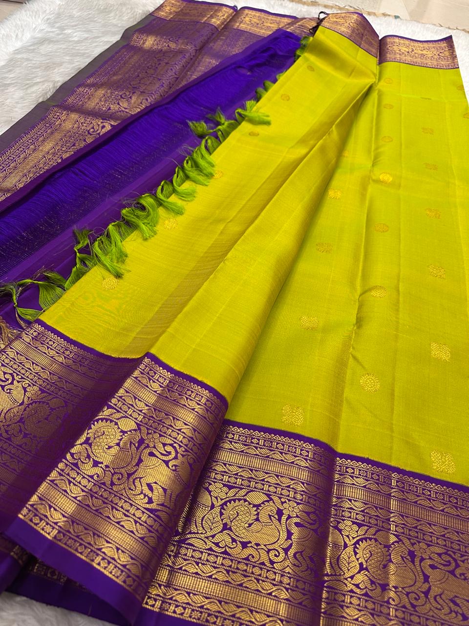 Kili Pachai Kanchipuram Korvai saree with deep purple border