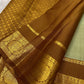 Pure Silk Korvai Kanjeevaram saree with green body and rich antique-gold zari border