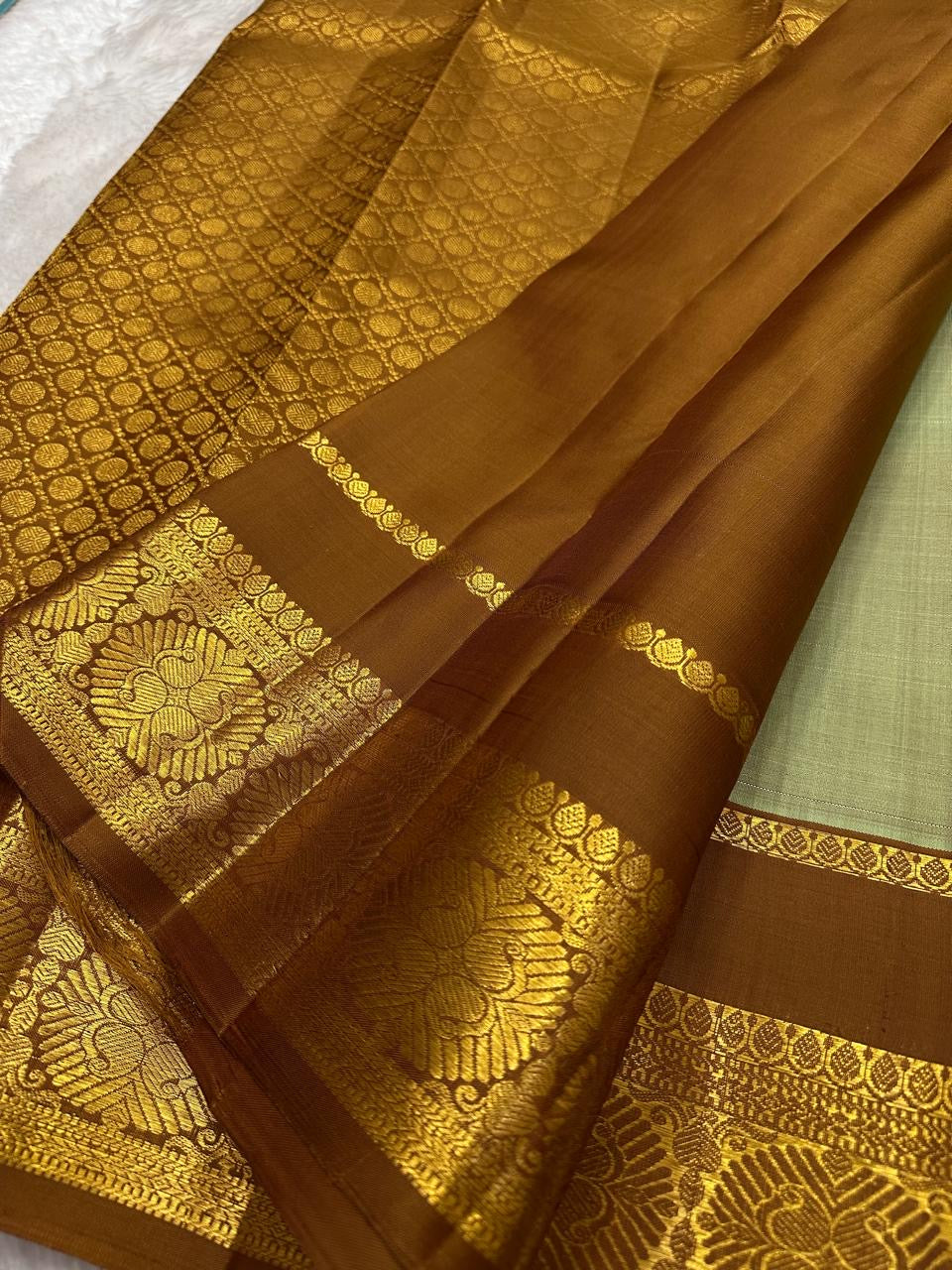 Pure Silk Korvai Kanjeevaram saree with green body and rich antique-gold zari border