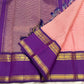 Royal purple zari pallu detail on the rose pink Kanchi Pattu saree, with kasu motifs.