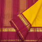 Canary yellow Kanjeevaram silk saree body close-up showing plain pure mulberry silk weave