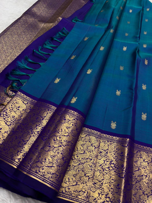 Pure Kanjivaram silk saree with traditional gold zari and temple-inspired motifs