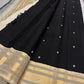 Black Kancheepuram silk saree with ivory buttas and gold zari korvai border pallu detail
