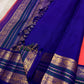 Korvai Kanchipuram saree coral sunset orange with royal violet border – pallu detail