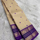 Korvai Kanchipuram saree warm sandal beige with regal violet border – pallu detail