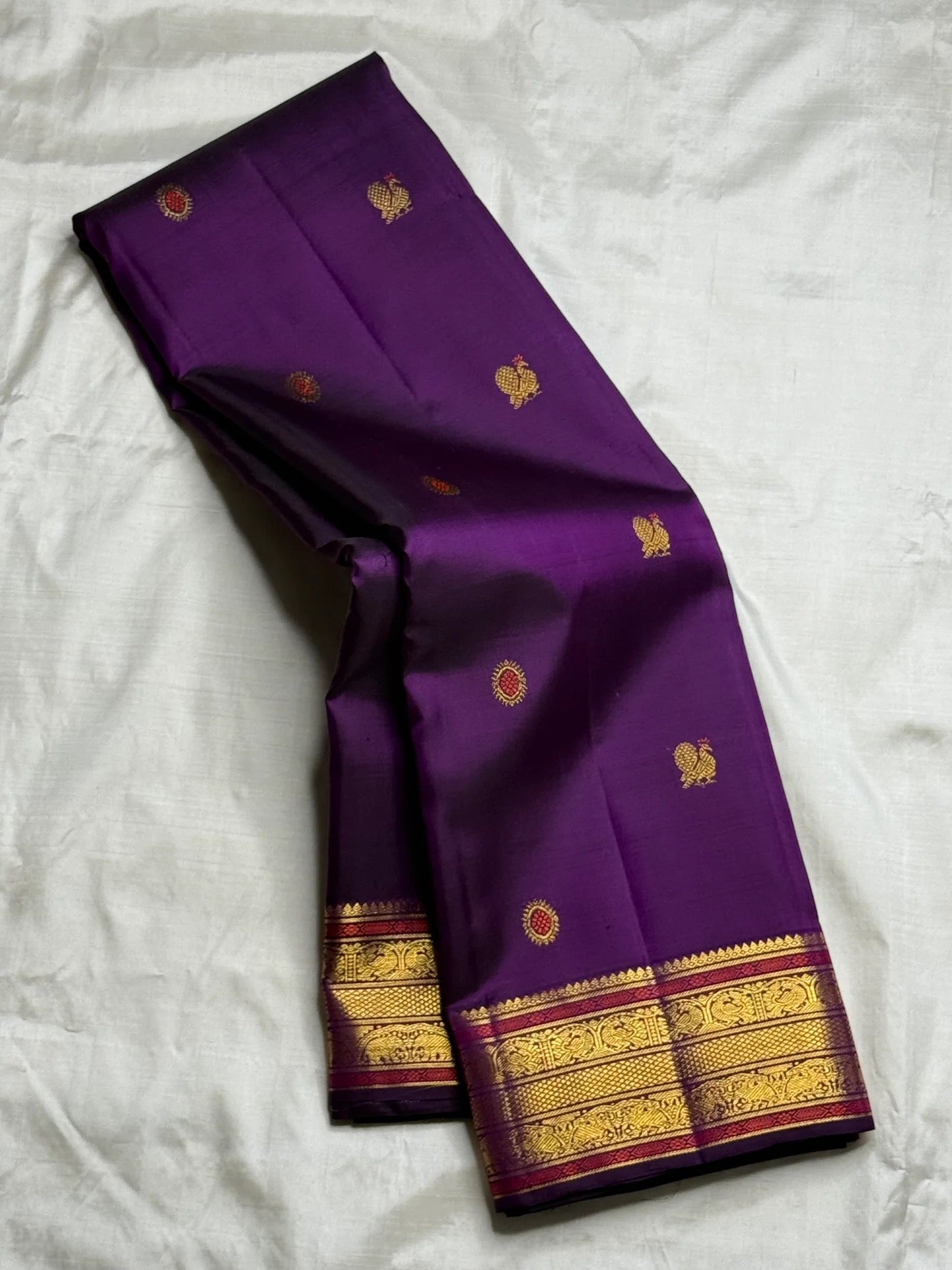 Korvai Kanchipuram silk saree – orange red tanpura pallu detail with traditional zari weave