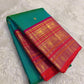 Kanchipattu silk saree in peacock teal with rani pink border Korvai Varisaipet weave traditional zari detail
