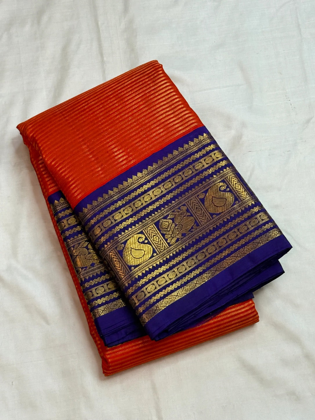 Kungumapoo orange handwoven Pure Silk Kanchipuram Vairaoosi saree with royal blue border
