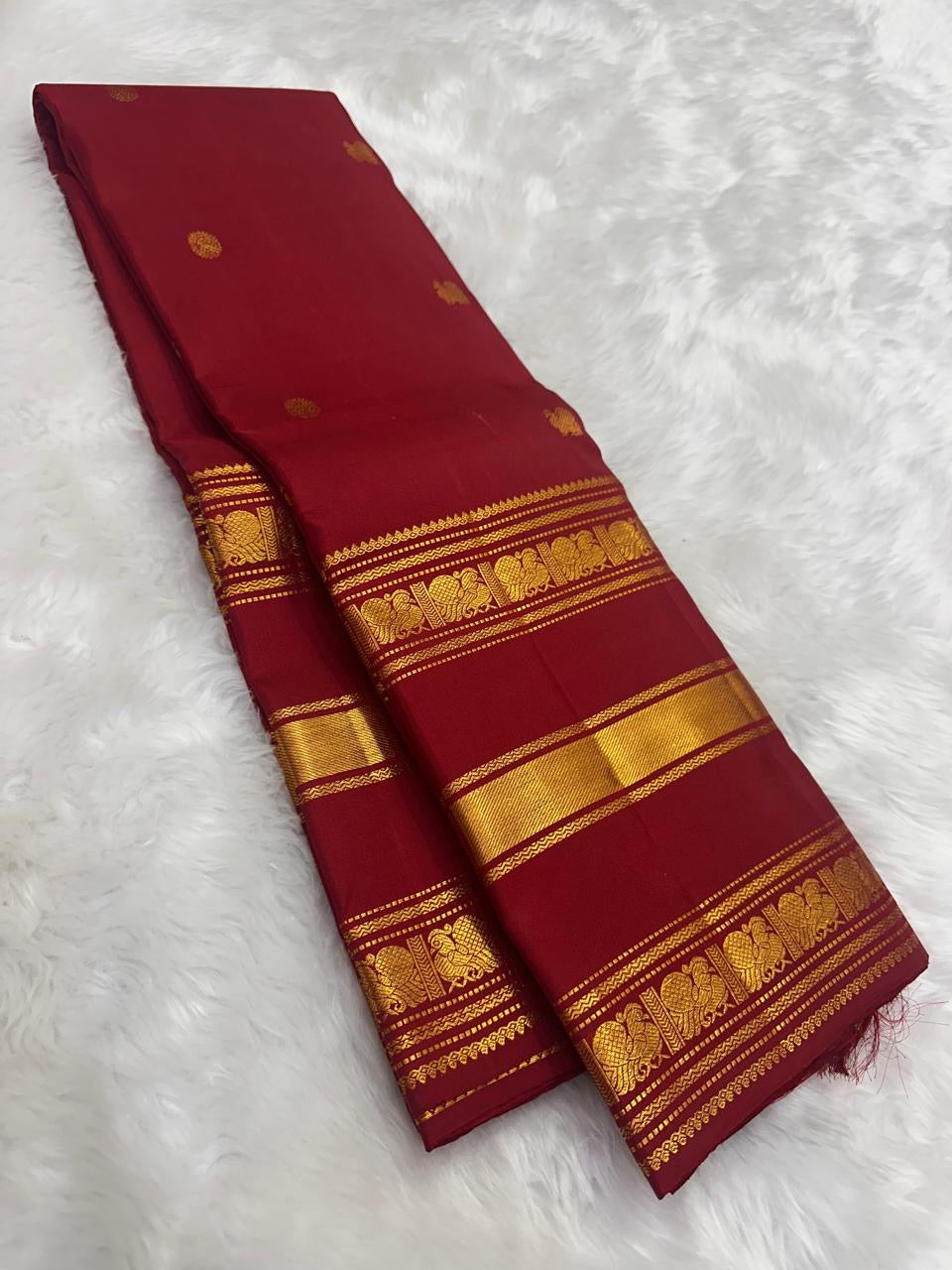Detail of gold zari elephant (Yaanai) motifs on the Arakku Red Kanchipuram silk border