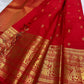 Kanchipattu silk saree in vibrant kumkum red with antique gold border Vanasringaram weave traditional zari detail