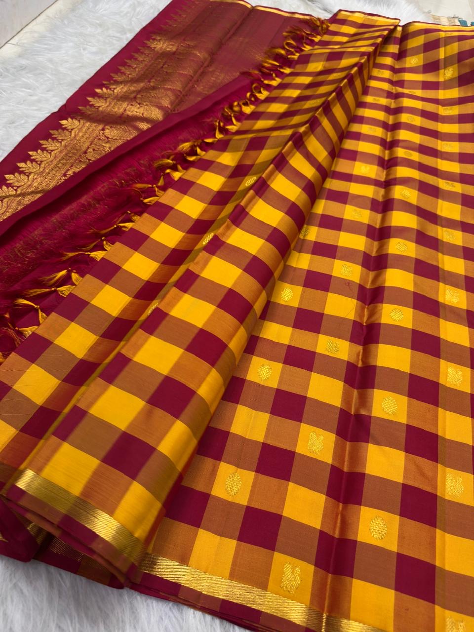 Deep kumkum red pallu with dense gold zari work on Paalum Pazhamum Kanchipuram saree