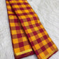 Close view of handwoven checked silk body with small ornate zari motifs