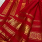 Kumkum red pure silk Kanjeevaram Rettapet saree, close view of the zari medallion border.