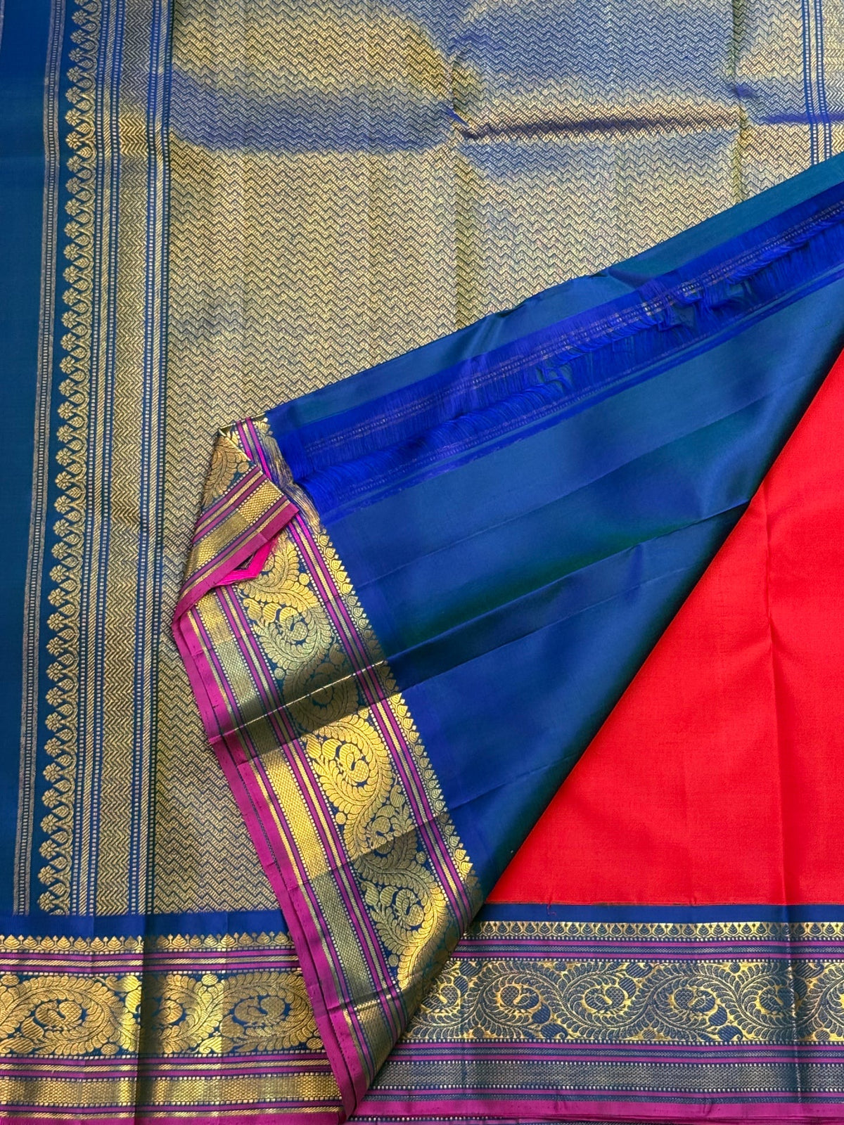 Kumkum red handwoven Pure Silk Kanchipuram Korvai saree with royal blue border