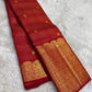 Fine classic-gold Zari Kattam forming measured geometry across saturated Kumkumam Red silk.