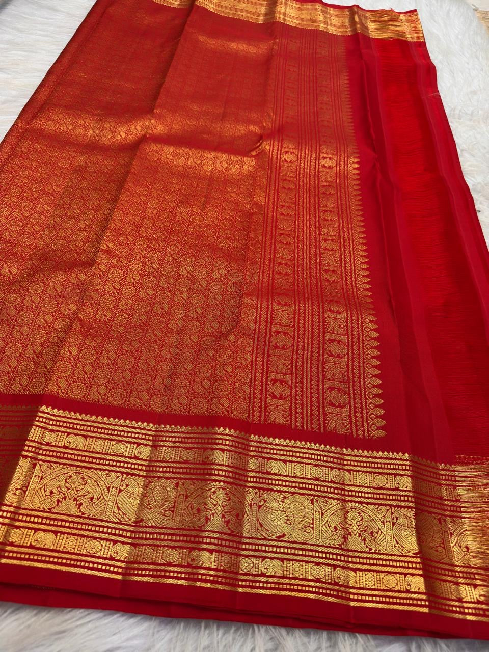 Kumkumam Red Kanchipuram Butta saree with Annam Mayil inspired zari border