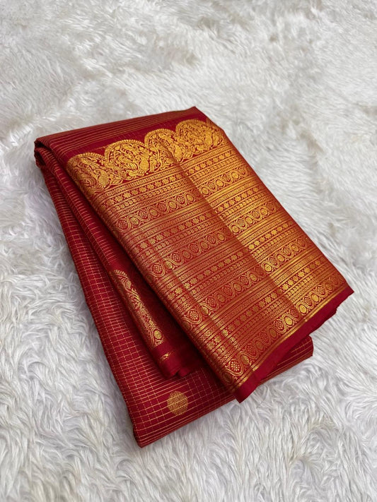 Kumkumam Red Pure Silk Kanchipuram Zari Kattam saree with richly worked classic-gold border.