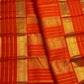 Handwoven jewel-toned orange Pure Silk Kanchipuram saree with a luminous plain body.