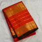 Grand dense zari pallu on a handwoven orange Kanchipuram silk saree with Yazhi, Yaanai and Mayil detailing.