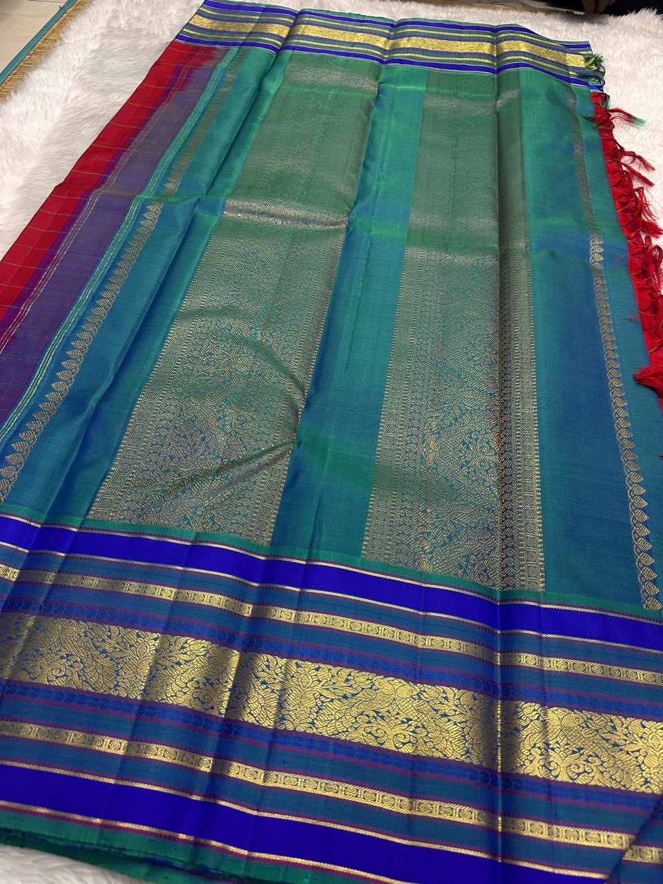 Kungumam red Kanchipattu saree sapphire violet varisaipet border USA