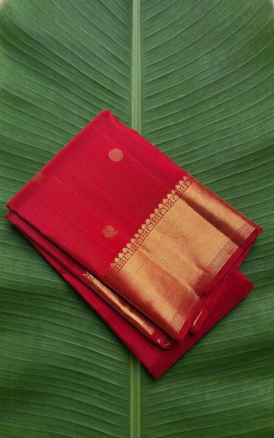 Pure Kanchipuram silk saree in kungumam red with antique gold zari border and traditional zari buttas