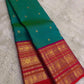 Kanchipattu silk saree in peacock teal with rani pink border Korvai Varisaipet weave traditional zari detail