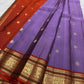 Close border detail showing classic-gold floral scrollwork against the warm Rust-Arakku contrast silk.