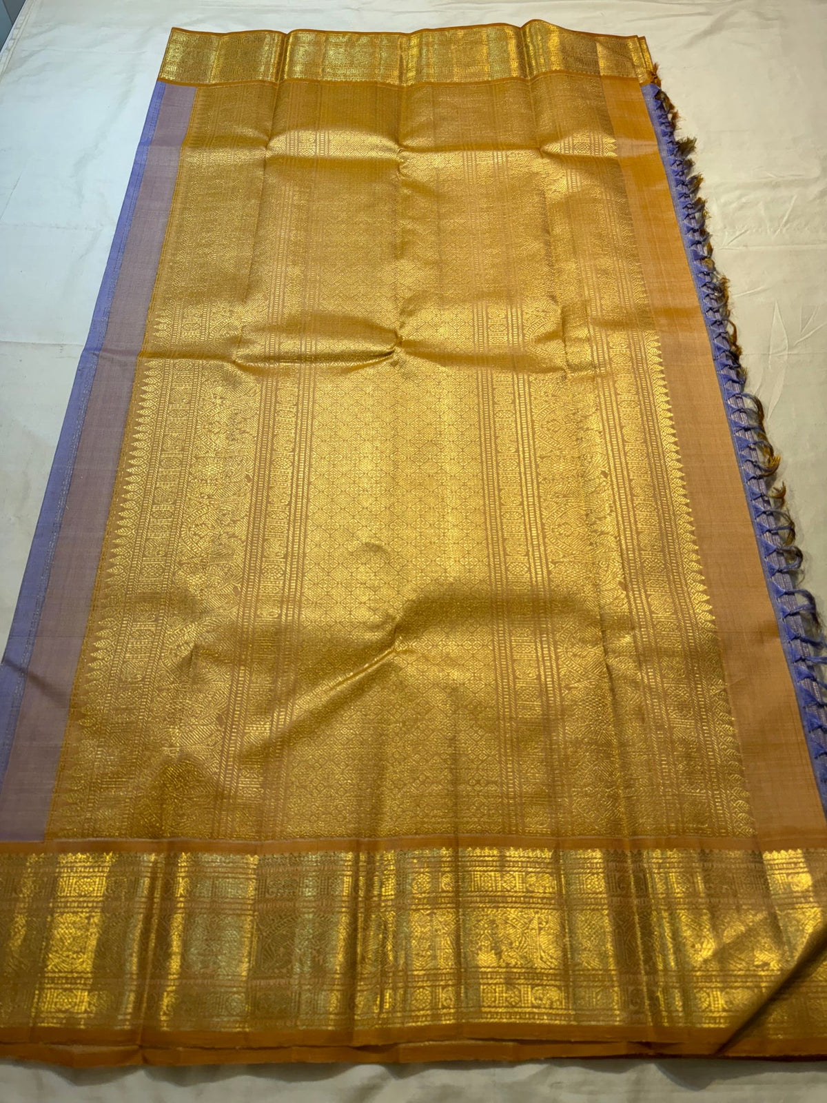 Lavender Vairaoosi Kanjivaram saree with delicate gold buttas