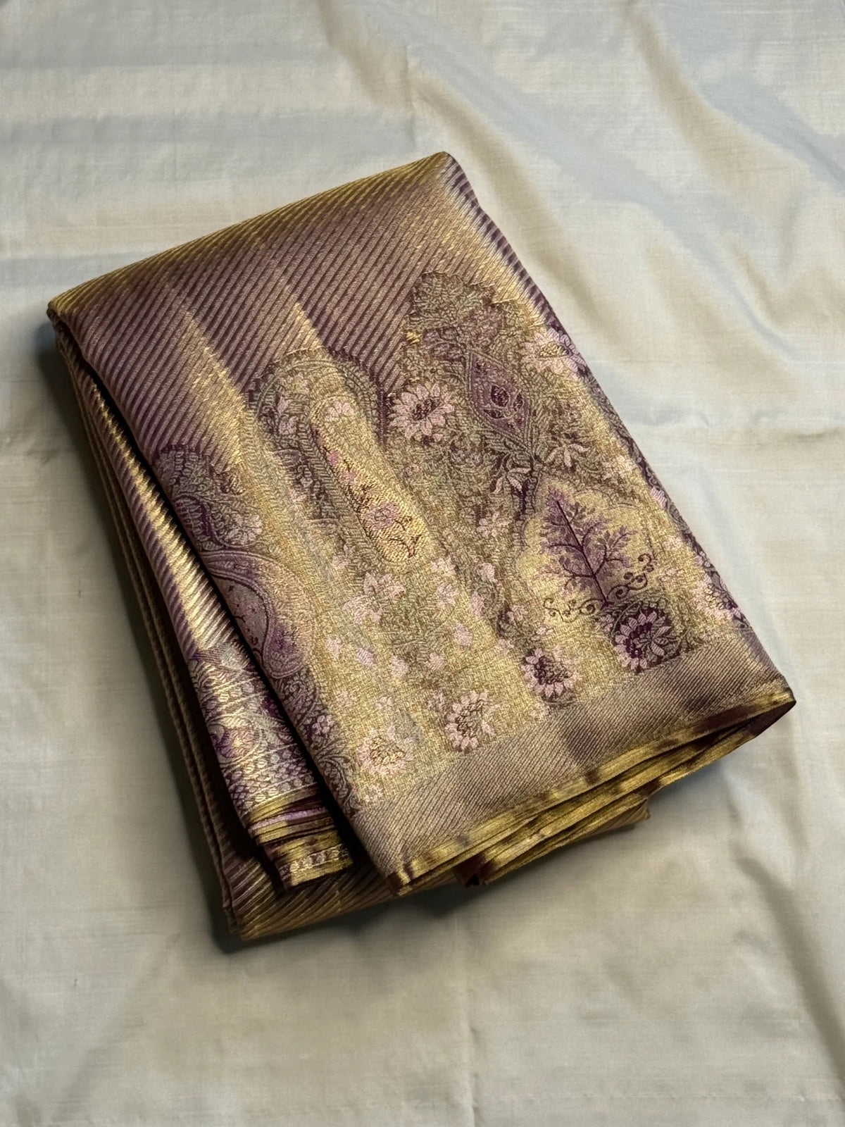 Handwoven light purple Kanjivaram silk with soft lilac undertones and a substantial gold-dominant 4-ply surface.
