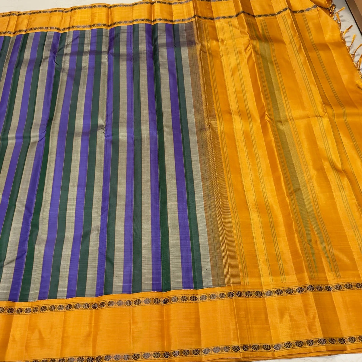 Closeup of the colour and border interplay on the Lavender Green and Grey Handwoven Premium Zariless Korvai Kanjivaram Saree with Golden Mustard Rettapet Borders.