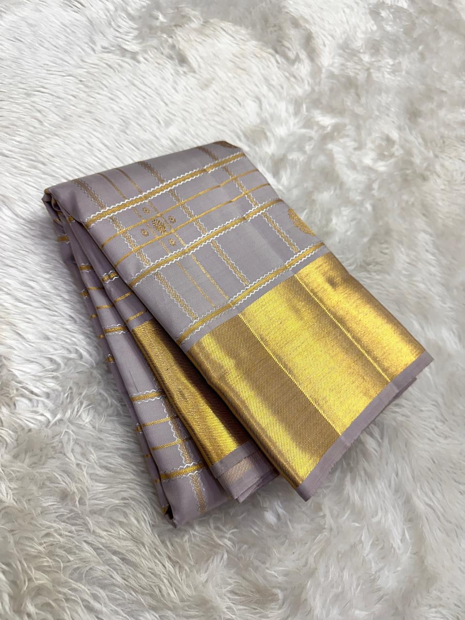 Lavender grey Kanjivaram silk saree traditional gold border detail